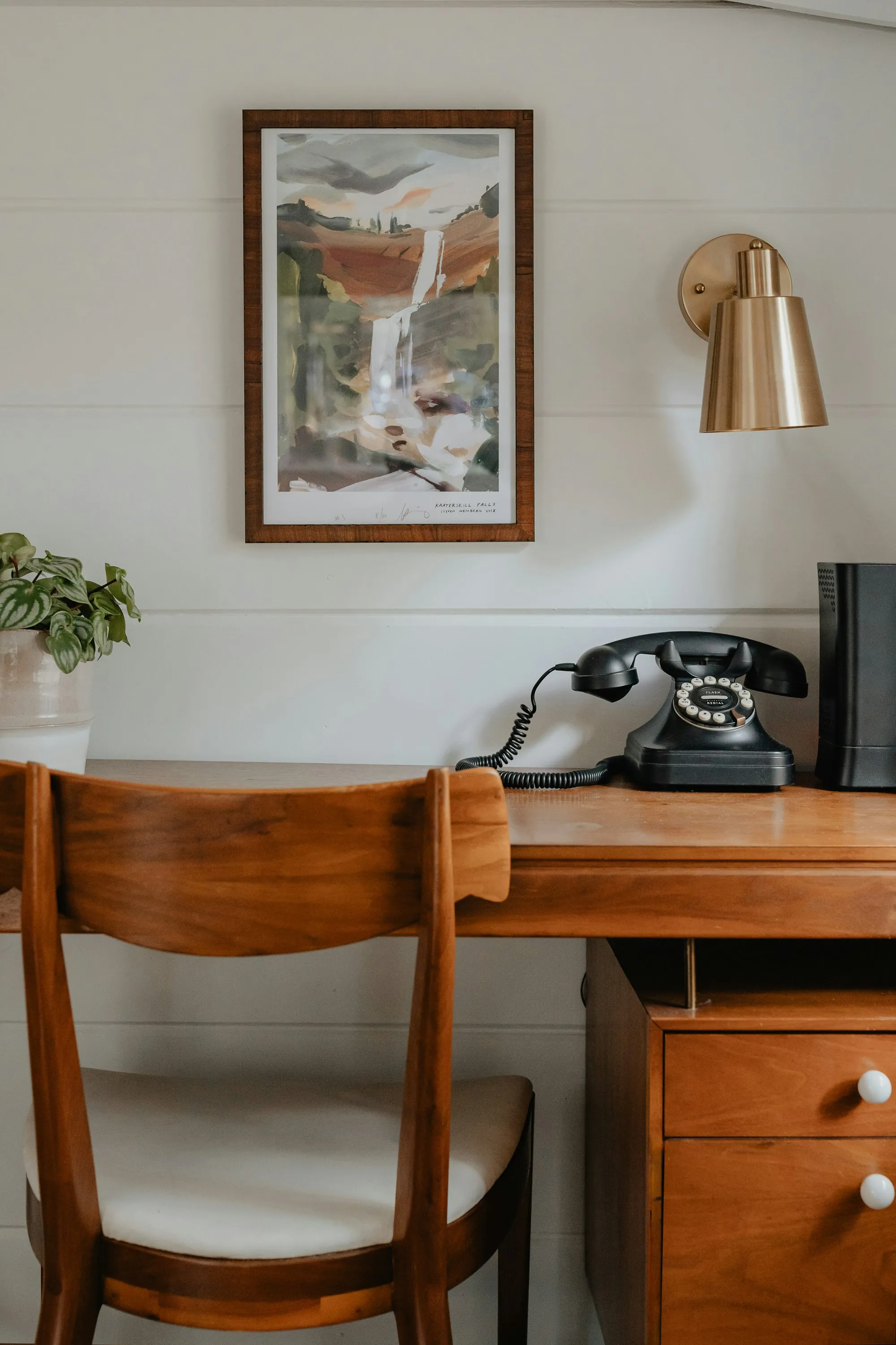 A telephone on a wooden desk