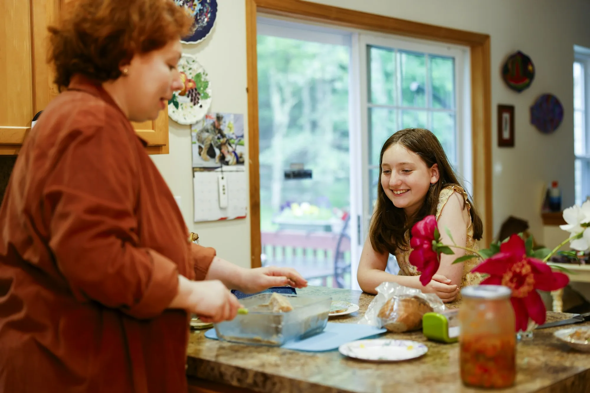 A woman preparing food in a home kitchen