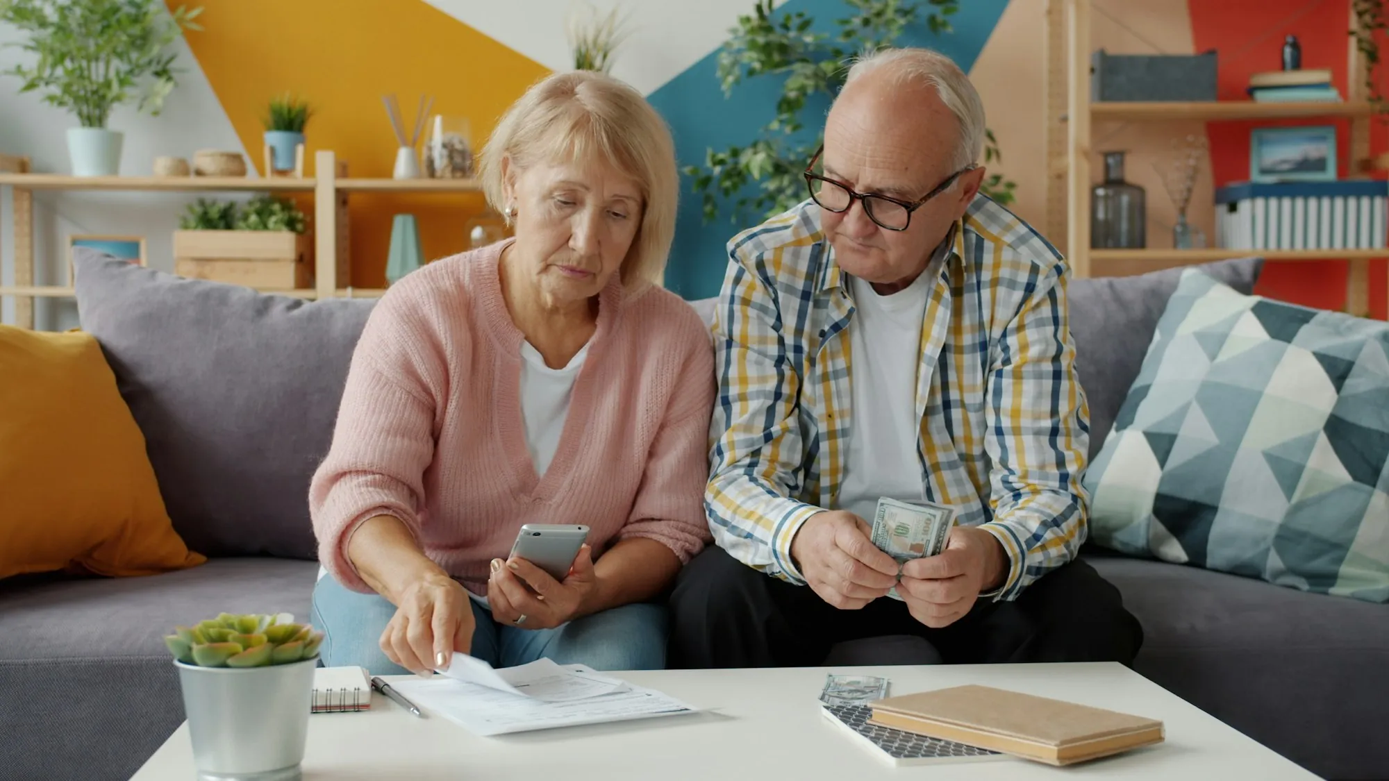 An older couple going through bills together